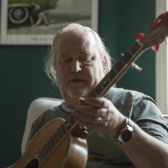 Plura with a guitar during the shoot